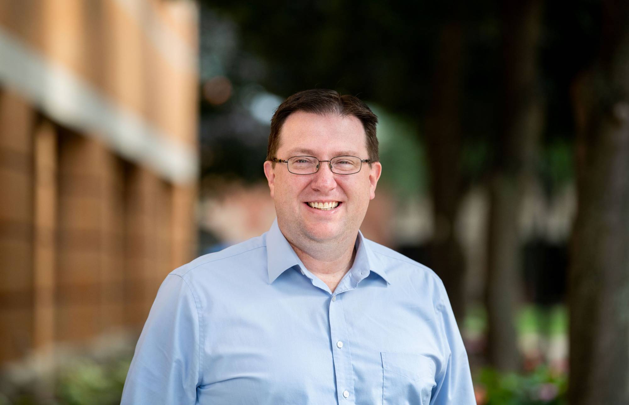 Neal Buckwalter in front of Devos